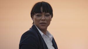 Lorcia Cooper as Detective Morapedi in Red Ink