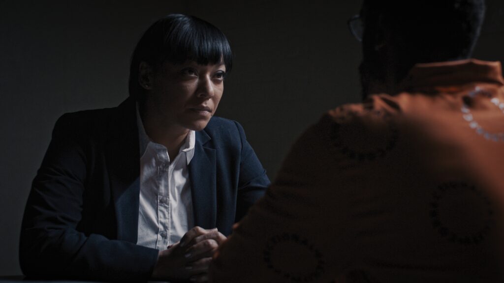 Lorcia Cooper as Detective Morapedi in Red Ink