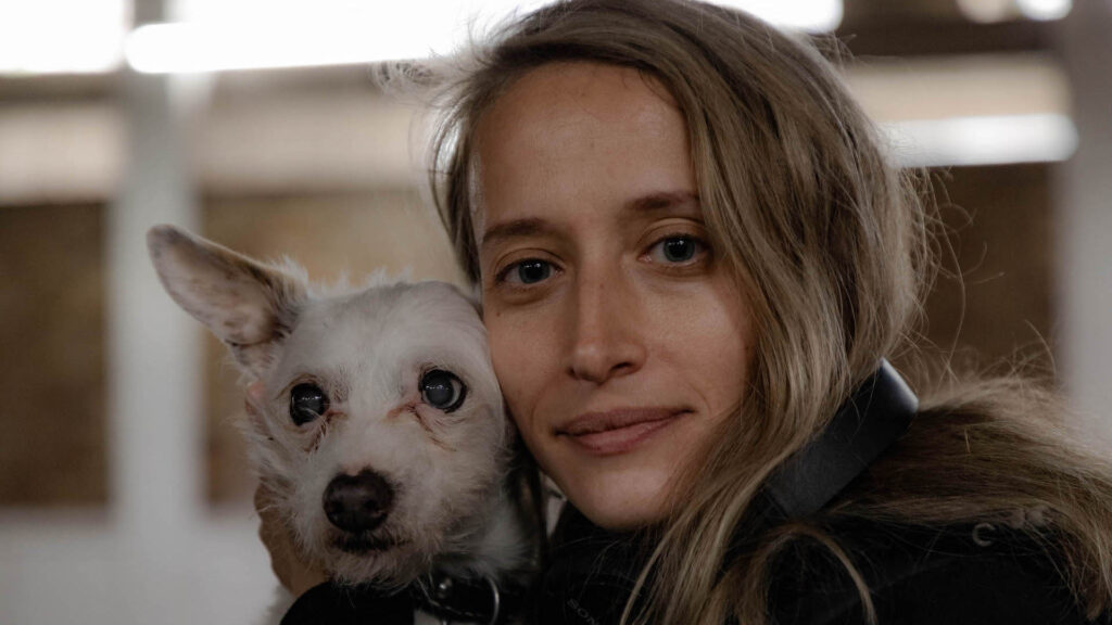 Kelsey Egan, director of The Fix and Glasshouse, with her dog, who also makes an appearance in The Fix